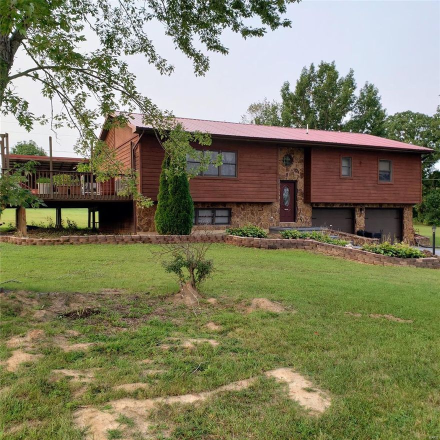 Close to post! Upon arrival you will notice a spacious 2 car garage, large yard and covered back porch which is perfect for entertaining.  The large living room features beautiful flooring, large windows for natural light and plenty of space for oversized furniture. The dining room opens to the kitchen which offers lots of cabinets and counter space. Down the hall you will find the master suite which features a full bath room and walk in closet. Two additional bedrooms and a guest bath complete the upper level. On the lower level you will find a family room, large fourth bedroom, laundry and third bath.