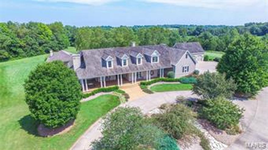 LARGE PRICE REDUCTION BELOW APPRAISAL. Listing includes 2 tax Id's; (1) 09-9-312-0-003-007000, 5,385 sq ft natural stone and wood sided 1.5 story home built in 2000 on 31.7 acres.Architect designed home features 4 BR, 5.5Bath, job site finished cherry and reclaimed pine floors, custom Wahle's millwork, dining room with wainscotting, office with waxed pine wall/ceiling panels,3 stone fireplaces. 2000 sq ft of covered aggregate porch/patios with beadboard ceiling surround home/pool house. Solid Mahogany front door. 1098 sq ft finish in the lower level w/built in cabinetry and full bath.  Newly refinished 35,000 gallon inground gunite/pebble tec ppool, 960 sq ft stone poolhouse with custom wetbar and full bath, stone fireplace, and spacious living area. 3 car attached and 3 car detached garages. Wood sided 50X50 outbuilding with metal roof, concrete floors and oversized garage doors. 2nd tax ID 09-9-312-0--003-007600 includes additional 5.1 parcel. See attached feature sheet
