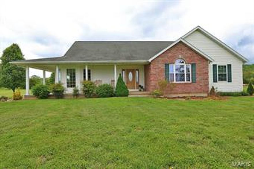 96 ACRE CATTLE FARM! Between the northwest foot of Mount Devin and the Little St. Francis River lies this remarkable cattle farm.  Centrally located in the property is a 12 year old, 1.5 story home with over 3000 finished sq. ft. of living space and views in every direction.  Adjacent is the headquarters of the livestock operation with a 66x80 barn with working pens, water and electric, all strategically placed in the heart of the fenced and cross fenced pastures making moving and working livestock a breeze.  A creek and cattle waterers provide abundant water sources, while the stocked pond adds recreational value to the property.  This property is located 1.5 hours south of St. Louis and 1 hour north of Poplar Bluff, just a few miles off of US Hwy 67.