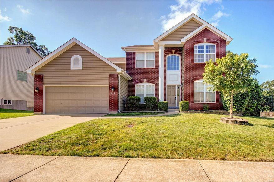 New price! Motivated seller! Welcome to this stunning two-story in Ballwin! A brick front and stately column make for an inviting exterior. Enter to the two-story foyer with the living room to the right and dining room to the left. You'll love the gleaming hardwoods, updated carpet (2017) and 9' ceilings throughout the space! Gather in the bright family room that features a gas fireplace. The kitchen boasts 42" cabinets, stainless steel appliances, and a butler's pantry. A laundry room and half bathroom complete the main floor. Upstairs, double doors lead to the master suite with a large closet, corner tub and separate shower, dual sinks and vanity. Three more spacious bedrooms and a full bath round out the space. The basement is ready for your finishing touches! The deck overlooks the fenced yard and woods beyond. Enjoy peace of mind with a new roof in 2017. On a quiet cul-de-sac, moments from schools, parks, and restaurants and shopping, this home is just waiting for its new owners!