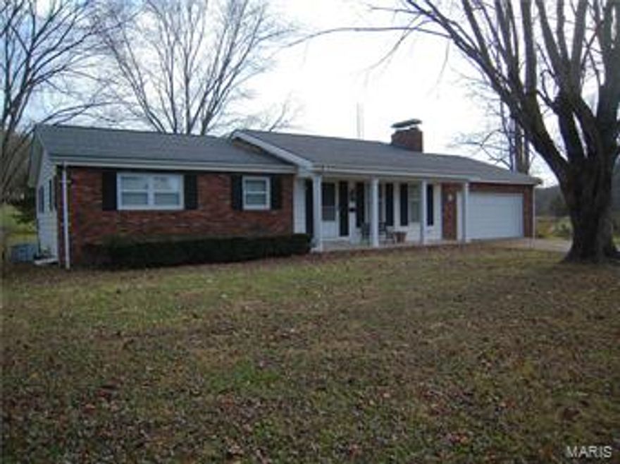 ***Contract Pending***Price Drop. Motivated Sellers***THE KIMBERLIN HOME. Enough said. We have all admired this home for years. Quality built & outstanding location. Park like setting w/the City Park just across the road. Just outside City limits makes it private but oh so convenient. 3 bed 2 bath home sits on 6.21 +/- Acres. Approx 4.5 +/- Acres in pasture. Living room as 1 wall that is tonged-n-grooved walnut paneling & a Rock fireplace w/blower & there's a wood bin w/access thru the garage . Down stairs although unfinished, has tonged-n-grooved cedar paneling & a brick fireplace, made w/bricks from the old County jail. There is also a laundry area. Home has a attic fan. 29X20 attached garage and a 24'X32' detached garage w/24'X15' addition for animal stalls and 14'X32’ open lean-to. Structures out of the flood zone. Reference Listing #16081017 for home & 43.21 +/- Acres for $190,000 & Listing #16081015 for 37 +/- Acres Land only for $74,000.