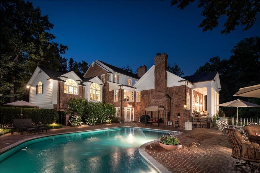 Phenomenal New price makes this Ladue hideaway the Best Value in Ladue! This stately Georgian colonial is set in an exceptional setting, is completely private, and at the end of a private lane. Current owners transformed the home to excellence in condition, which is flawless. Lush gardens and artistic landscaping are keynotes that have been additions to the 1.4 acre setting, as well as a new roof, gutters and downspouts. Find an inground pool and remodeled pool house. The main level Master wing provides dual baths, dual organized closets and a separate staircase leading to the gym. Three additional suites are on  second level. The office is one of the hone's most interesting features, with a mezzanine level view. The Great Room addition is comprised in French doors, palladians which flooded natural sunlight. Large living and dining Rooms. The walkout lower level has an all new full kitchen and bar, for servicing the pool, outdoor entertaining and patios of the property.