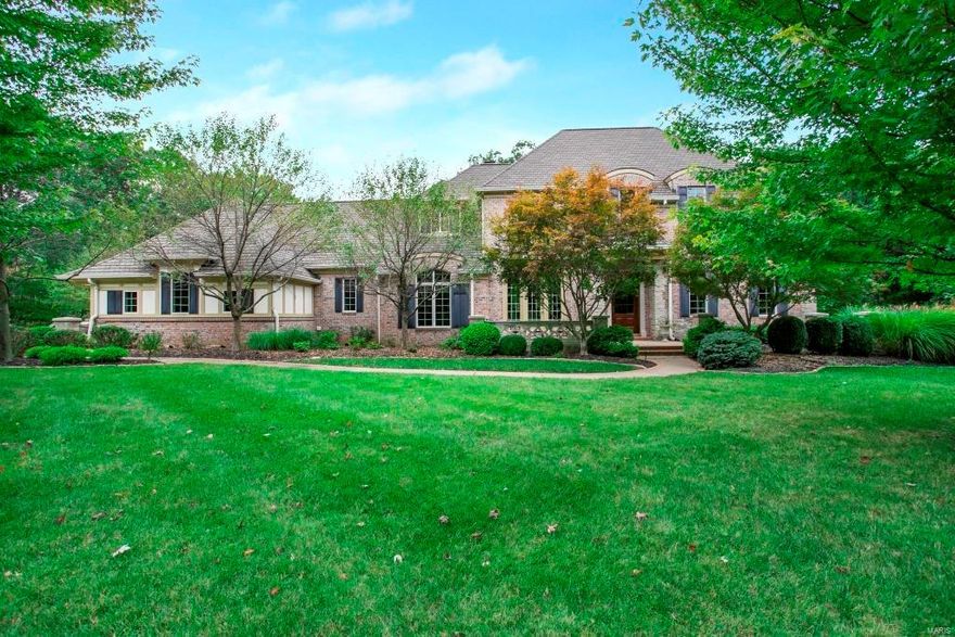 1.5-Sty, 1.26 acre lot w/6Bd, 7Bth & 7400+ Sqft including W/O LL! Dining Rm w/crown molding! Great Rm w/12’ ceilings, built-ins, see-through FP joins Hearth Rm, Kitchen & Breakfast Rm, wet bar & planning desk. Kitchen w/42” custom cabinetry, quartz countertops, slate backsplash, Viking cooktop; double ovens, panel fridge, W/I pantry, island w/breakfast bar! Turret style Breakfast Rm, Office w/box beam ceiling, millwork, wainscoting & built-ins! Master w/FP, built-ins, crown molding & bay window!  Master Bth w/dual vanities, jetted tub, W/I frameless shower, tile surround & 2 shower heads w/body sprays plus a W/I closet designed by St. Louis Closet Co! UL Loft & 3 en suite Bd! LL Rec Rm w/see-through FP, Media Rm, Family Rm, wet bar & Dining Rm; plus the 5th & 6th Bd. Highlights: composite deck w/spiral staircase, huge patio, landscape lighting, hardwood floors, pillars w/stone column bases, 3 car garage, 3-zoned heating/cooling w/2 newer AC units & newer furnace, irrigation system!