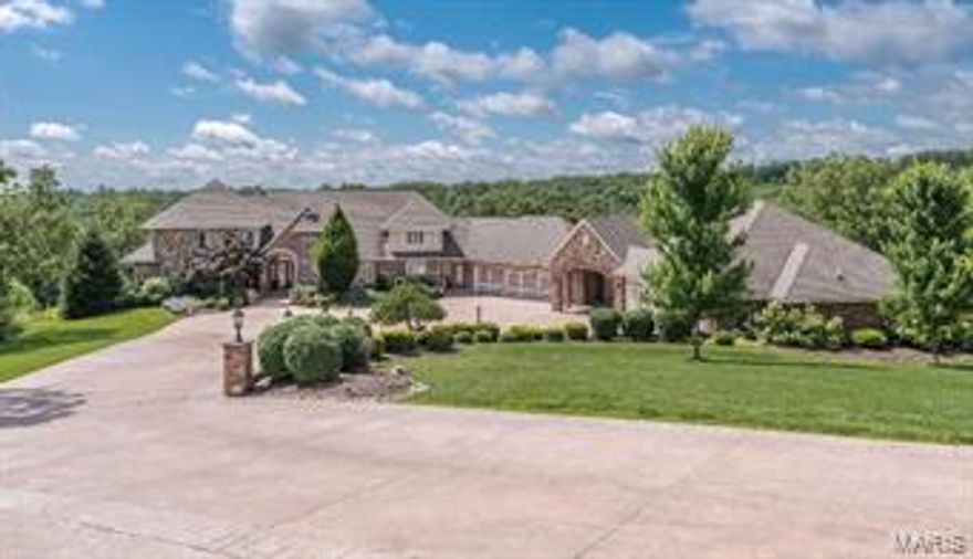 PRIVACY EXTRAORDINAIRE! Elegant & refined home in Sullivan resides on 18.1ac of beautifully landscaped grounds. Enjoy breathtaking views year round. 6BR/6BTH  home offers the ultimate in privacy & gracious living. You are greeted w/ a large tiled entry way, elegant dining rm & dramatic vaulted great rm w/ floor to ceiling F/P, wet bar & 3 window bay. Main floor master features F/P, luxurious bath & sitting rm used as a study.  Cook's dream kitchen w/ granite, SS appliances, 42” custom cabs, gas range & brkfst rm that provides access to party perfect patio overlooking sparkling pool. Den boasts built-ins & F/P perfect for family gatherings. 4 generous BRs with W/I closets, 2 full bths & loft upstairs. Finished walk-out LL will blow you away! Rec rm, fam rm, full kitchen, BR & full BTH plus fitness rm. MFL & second floor laundry, custom pool house w/ kitchen, full bath & laundry unit. Hot tub, basketball court, 6 car garage. EXTREMELY UNIQUE OPPORTUNITY - THE VIEWS ALONE WORTH THE PRICE!