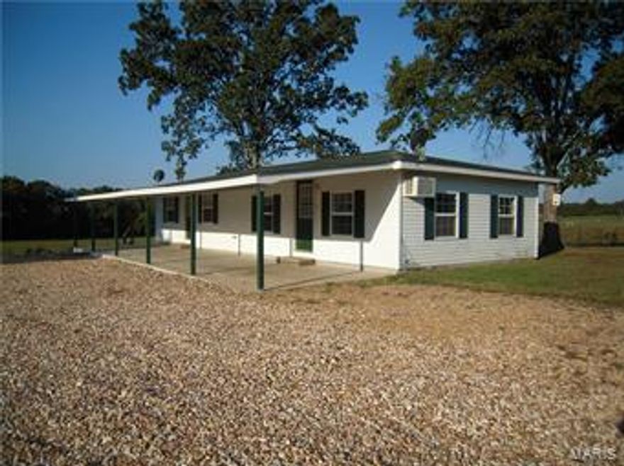 DO A DUPLEX .. rent it out or live in one and rent the other or move the entire clan in, your decided. What a cute light and airy rental with just the right amount of natural light streaming in to make it open and airy.  Great room captures the kitchen (with range & refrigerator), dining area and living room, full bath has stack washer and dryer and lots of room, large bedroom with closet is a sure tenant keeper.  Crawford Electric is low utility and tenants love that.  A huge covered front patio + tenants have a garage to split between them or..you keep it for maintenance machinery.  Only 7 miles from town, check it out and you will check into this awesome opportunity.  Call today, we are anxious to show you this incredible place.