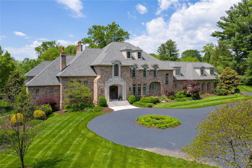 This exquisite Freeman-built home on 3 acres in the heart of Ladue, features the most incredible ceilings & elaborate millwork, like no other! 2 story entry w circular staircase & opens to a flr to ceiling wood paneled office & the formal dining rm. Open great rm w wood beamed ceiling, wet bar w beverage & wine cooler, limestone FP, 3 sets of arched windows w a dr that leads to outdr patio that steps down to the pool area & fire pit. Gourmet kitchen w 2 center islands, full sized Subzeros, gas range, 3 ovens, 2 dishwashers & sinks, walk in pantry & a breakfast rm & hearth rm w stone FP. Coffered master bedrm suite w spa like bath & his/her large walk-in closets w a laundry closet. 4 En suite bedrms on 2nd level, full laundry rm, & an open study area. The walkout LL has a 1000+bottle wine cellar, media rm, game rm, exercise rm, large wet bar, 2 storage closets & a 6th bedrm, full bath w a steam shower. 4 car garage, circle drive, 5 FP, sprinkler system, generator, & a fenced yard! Additional Rooms: Wine Cellar