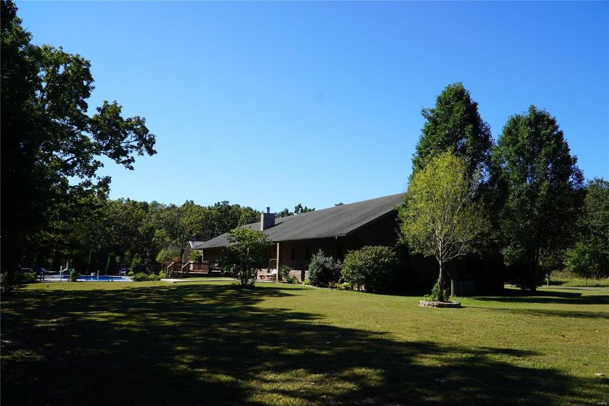 Awe inspiring 6790 sq. ft. All Brick home with oversized garage. Hardwood, tile and carpeted floors thru out home. Huge kitchen with massive granite countertops on vast amounts of Oak cabinets resting on beautiful hardwood floors. Colonial style interior walls in formal dining and living room and a see thru wood fire place between kitchen and living room. Four bedrooms upstairs with ADA compliant closets and bathrooms as well. Downstairs is a hugh play area with extra high ceilings for all kinds of gaming and exercise. Also a kitchen with resin countertop, a family/movie room, a full bath and two bedrooms (no regress windows ), a work shop, a man cave (possible 6th bed) and tons of storage. The two bay garage is extra large and three or 4 vehicles could be parked inside. Outside we have a Metal building (30x40 appx.) with concrete floor and electric for all your equipment. 18X36 inground swimming pool with black wrought iron fencing and deck with beautiful land scaping ready for you