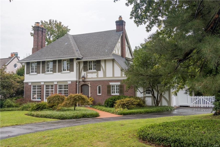 A charming and historic treasure on one of St. Louis' most admired streets, just a short walk to Clayton and all that this hip area has to offer. A Maritz & Young tudor, this 3 bdrm/2.5 bath home has been lovingly cared for and exhibits an eclectic vibe perfect for entertaining. Updated kitchen with newer baths on gorgeous level lot with lush gardens surrounding quaint outdoor living spaces. Tastefully appointed and graced with gorgeous hardwood floors and show-stopping windows throughout first floor.  Second floor den with fireplace could potentially be turned into a bedroom with an added closet should one wish.  A treasure surely not worth passing up.