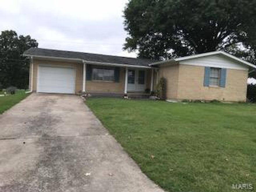 Full brick home on double-lot! First time on the market. Home has mostly hardwood floors throughout. Separate dining room, living room, and kitchen. Eat-in kitchen has ceiling height wood cabinets. Three bedrooms each with a large closet. Master bedroom has half bathroom. One full bathroom on main level. Basement is partially finished with family room and bar area. Unfinished part of basement has workshop area, storage room, and laundry room. One car attached garage. Golf course like grass is an added bonus! Located in Mark Twain School District.