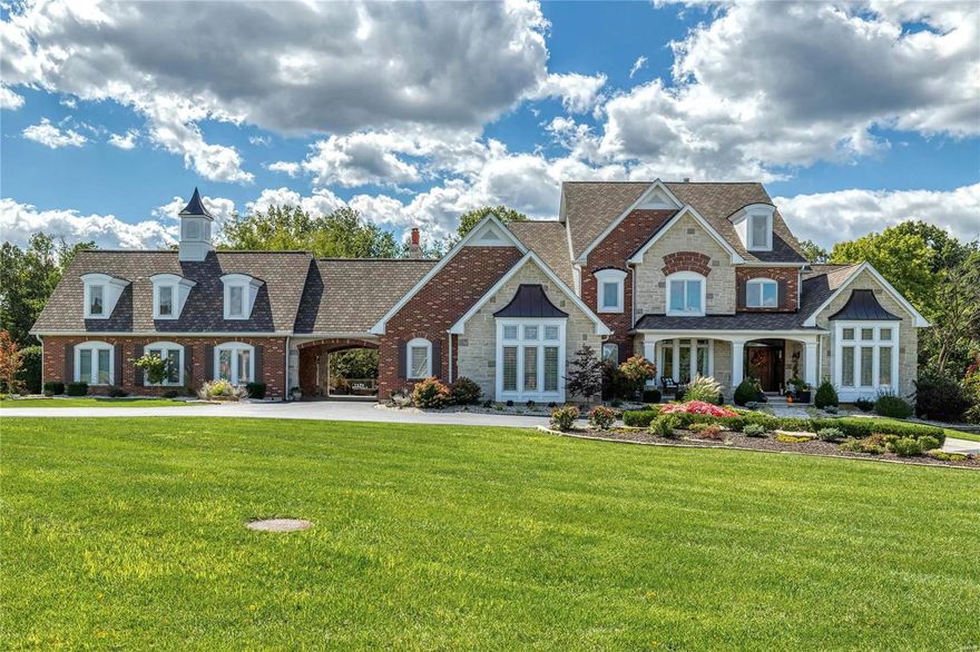 Beautifully designed 9000 sf Estate home on wooded 3-ac grounds. Impressive 2-sty foyer leads to elegant dining room & stunning great room with architectural pillars, wet bar, marble fireplace flanked by built-in bookcases & expansive windows with private wooded views. Designer kitchen with 42” white cabinetry, quartz countertops, commercial grade appliances, 10’ center island & butler’s pantry adjoins light-filled breakfast room with breakfront & hearth room with stone fireplace. Coffered primary bedroom suite with marble bath & adjacent study offers an appealing retreat. Sports enthusiasts will love the golf room with wet bar & cart storage. Front & rear staircases access 3 additional bedrooms, 1 with ensuite bath & 2 with Jack n’ Jill bath. Lower Level includes recreation room with wet bar, billiards room, media room, game room & 1 ½ baths. Atrium doors open to outdoor living area with deck, covered patio & fire pit plus hot tub & resort style pool surrounded by landscaped gardens.