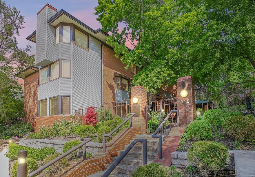 A rare opportunity to procure a stunning ground-floor, double unit condo with over 3,100 square feet of living space in sought-after Kingsbury Place. Three sides of exterior views, two of which are flanked by spacious covered terraces. Inviting formal Living and Dining rooms are graced by a wall of windows, and feature the first of two fireplaces, a custom wet-bar and a stunning neutral palette. The spacious Kitchen features gorgeous custom cabinetry and a massive center island. Escape to the quiet den, featuring custom bookcases surrounding the cozy fireplace, wood floors, and access to the courtyard-facing terrace. Expansive Primary Suite features a large sleeping space with custom walnut built-ins, a private Office/Library/dressing space, a spacious walk-in closet and gorgeous Bath. A secondary Bedroom and full Bath complete the sleeping quarters. Enjoy the elegant Clayton lifestyle with walkability to fine dining and entertainment. Location: Ground Level