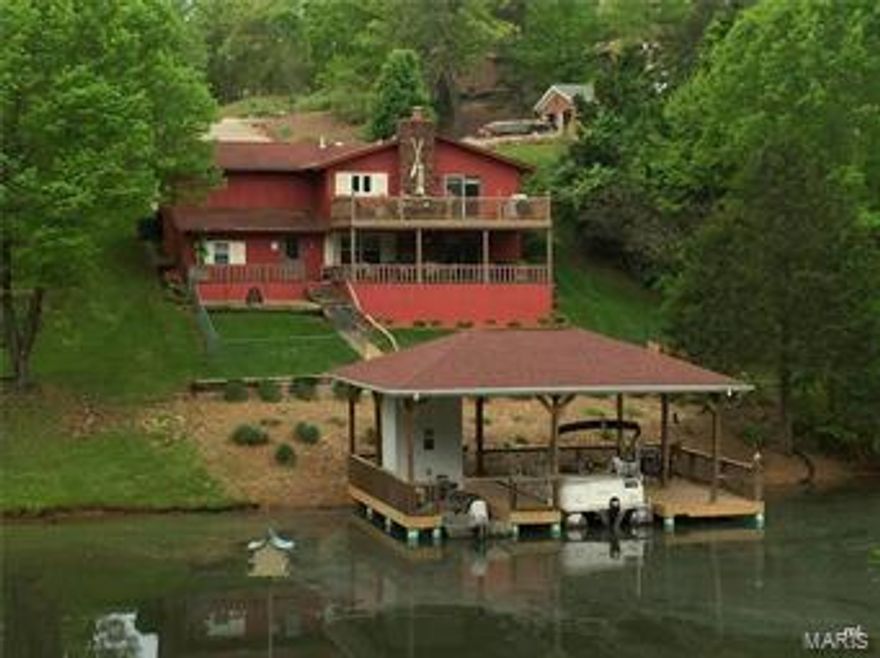 Looking for a Great Lake home this is it! Enjoy a  2 bedroom 2 bath home with attached garage, 25X14 composite deck to relax on Beautiful lake Carmel!  Covered patio off the walk out basement, 8X20 extra storage, Covered boat dock with double slip. Nicely landscaped and well maintained move in ready property!  Terre Du Lac offers 15 lakes, golf coarse, tennis court, pool and two beaches.......