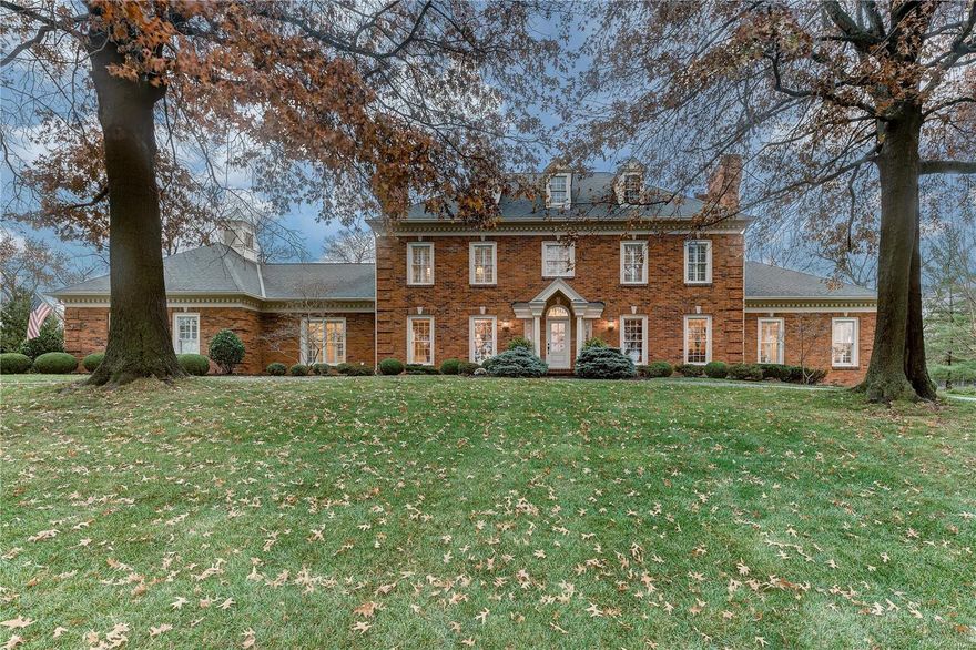 Elegant 1.5 story tucked away on a manicured 1-acre lot in one of Town and Country’s most picturesque neighborhoods. Numerous updates and upgrades including wood floors through most of the main level, elegant molding, millwork, built-ins and plantation shutters. A 2-story foyer is flanked by an elegant living and dining room each with beautiful gas fireplaces. The family room with rich wood paneling and fireplace walks out to a vaulted screened porch overlooking the pool, waterfall, Koi pond and lovely landscaping. The main level master suite has a beautiful office, a coffered tray ceiling, fireplace and spectacular updated bath. The kitchen features a gas cook-top, center island with breakfast bar and granite counters. The upper level is served by 3 bedrooms, 2 full baths and a loft. The finished lower level has a large rec rm with a fireplace and wet bar, a full bath and exercise room.