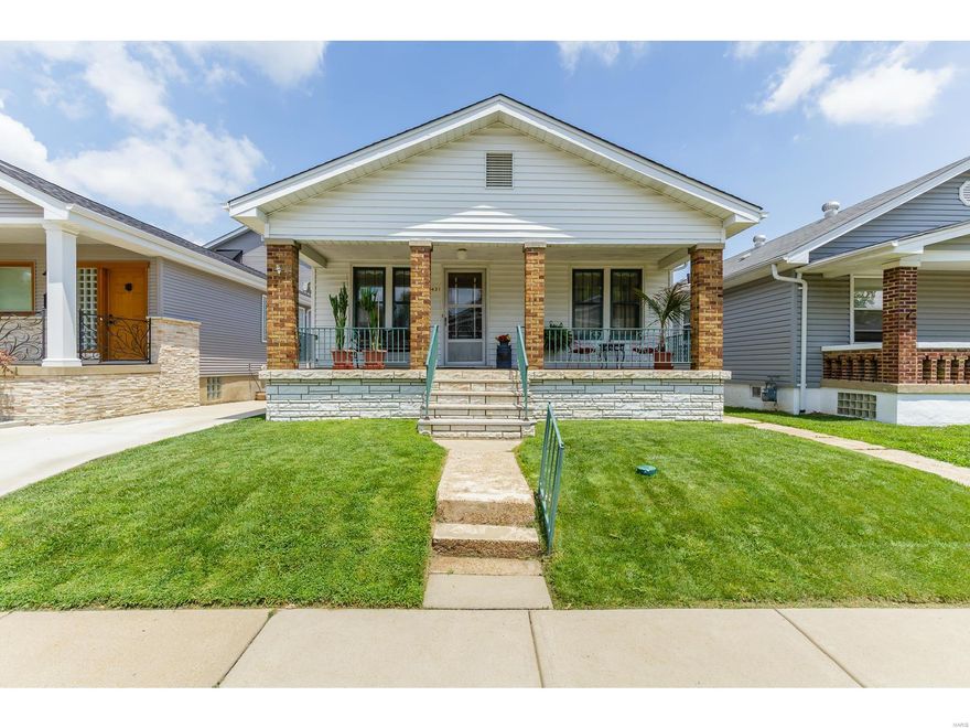 Charming Bungalow Home With Original Hardwood in Living Room and Original 8" Base Boards! Original Front Door and Interior 15 Panel Doors With Frosted Glass Are in Several Rooms! Large Eat In Kitchen With Bonus Room & Convenient Back yard Access! Well Maintained Family Home With Much Original Mill-work Throughout! Back Yard is an Oasis of Privacy! Patios, Water Features, Covered Eating Areas, Bar Area, One of a Kind 3 Seasons Outdoor Bathroom! Grape Vine and Strawberry Patch are Included! Oversized 1 Car Garage Has a 200 Amp Line Connected From House - Just Needs a Panel to be Installed Inside Garage! Home is Located on The Hill, on  THE Street Also Known as "Hall of Fame Place"! Yogi Berra, Joe Garagiola and Jack Buck Grew Up on This Street !!! Add 17 Famous Restaurants Within Walking Distance and What  More Could You Want???