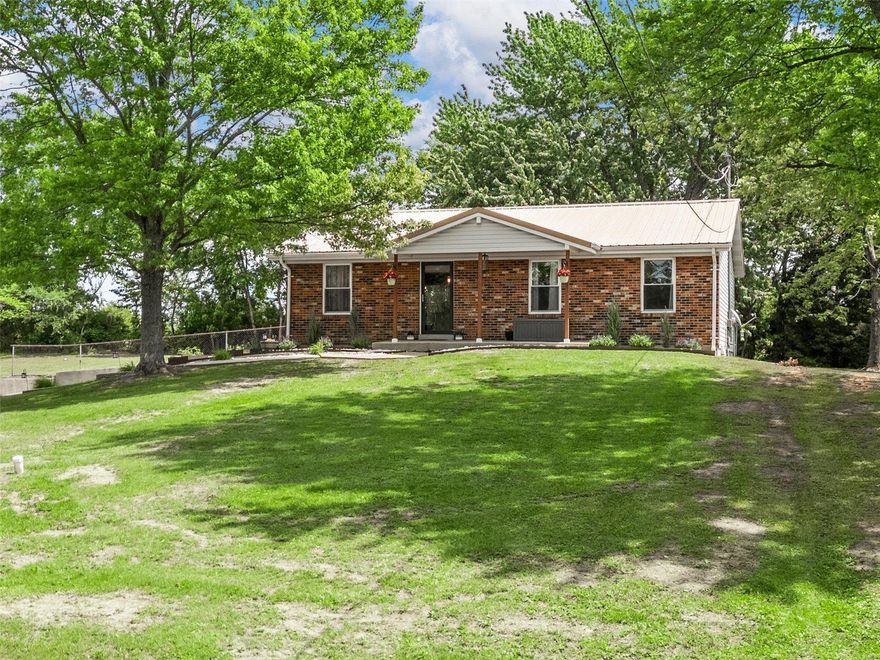 Located on over a half acre this charming ranch offers an open floor plan with 3 bedrooms and 2 bathrooms. The property welcomes you with beautiful shade trees as you pull in the driveway. The living room and dining room with a vaulted ceiling create a welcoming entrance to the main level. The bright and open floor plan with luxury vinyl plank flooring flows into the spacious kitchen with a breakfast bar and sliding glass doors opening to an expansive backyard. The kitchen features SS appliances, abundant countertops and a center island. The main level includes 3 bedrooms. The primary bedroom includes a large closet and luxury vinyl plank flooring. A full bathroom and 2 additional bedrooms both have large closets and carpeting. The walk out lower level showcases a large family room with luxury vinyl plank flooring, a laundry room and another full bathroom. Enjoy the summer months on your back patio in the tree lined backyard. A tuck under garage offers room for storage.