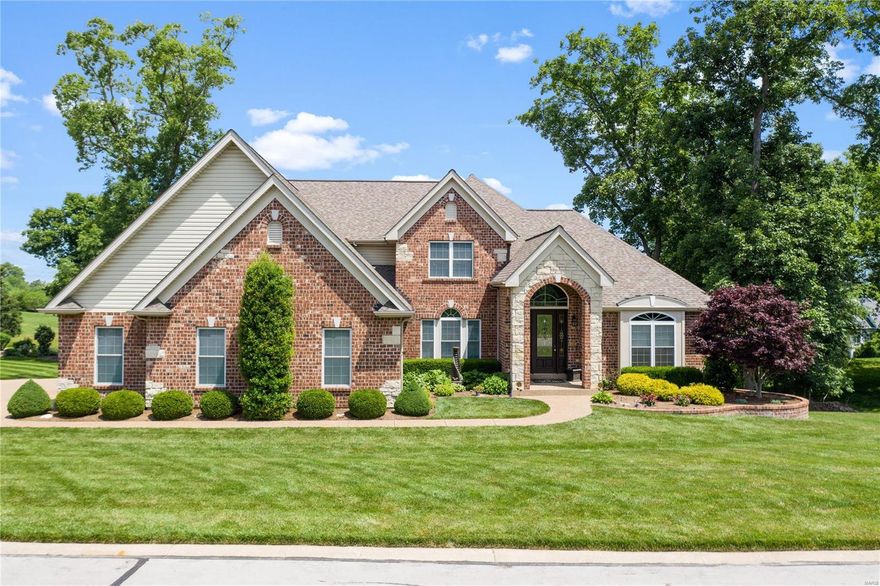 This stunning estate offers all the desired appointments w/incredible views at every turn. The home sits on one of Whitmoor's most prestigious streets. The grand entry foyer wow's w/soaring ceilings & opens to the breathtaking 13 mile view from the great room atrium windows. Simply incredible inside & out, this home was built for entertaining. Impressive cook's kitchen is the heart of the home w/42" maple cabinetry, upgraded appliances, butler's pantry & a spacious hearth & breakfast rooms which opens to the fabulous screened porch w/a full masonry fireplace & sundeck. The grand master suite boasts his & her walk-in closets, luxurious jetted tub & massive walk-in shower w/multiple shower heads. Open wrought iron spindles guide you up to 3 large bedrooms, w/walk-in closets, jack & jill bath & private ensuite. The showstopper is the LL w/full bar/kitchen, 5th bedroom suite, spacious rec room & 2 flex rooms. Sit back & enjoy the phenomenal view of the lake, 15 South Green & fairway!