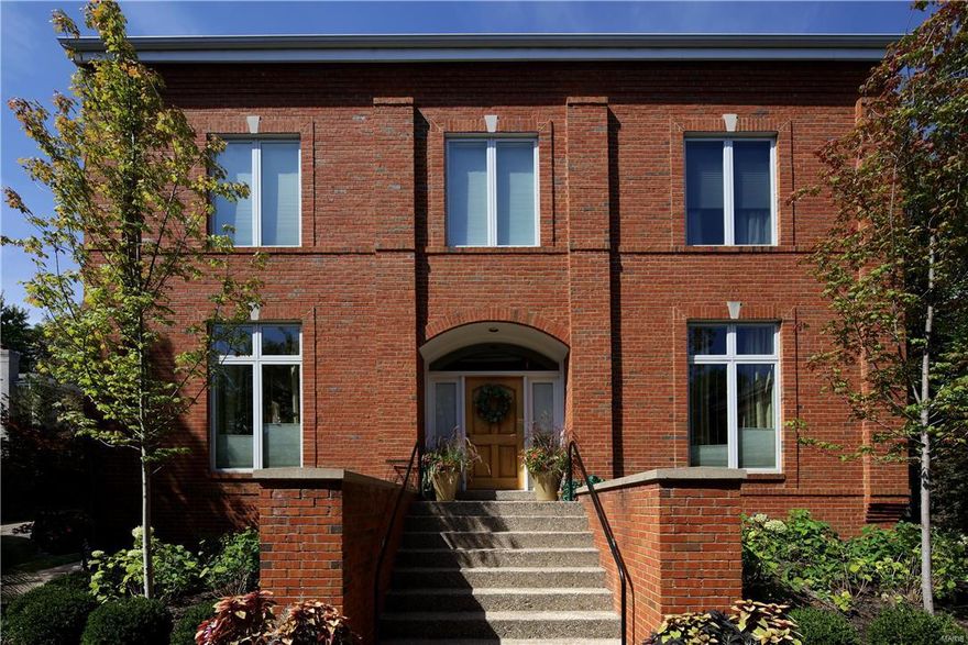 Dramatic and sophisticated urban living within blocks of Clayton business district. Fabulous open floorplan with soaring 10' ceilings on main level and oversized windows infuse light to every level of living space. The grand foyer opens to large living room with gas fireplace & raised marble hearth, 2 sets of glass doors open to the terrace and in ground pool with waterfalls and Japanese garden...an urban oasis!
 This residence offers formal dining room, powder room, wood floors,  and recessed lighting. The kitchen/den area is perfect for entertaining. Chef's kitchen with SubZero, 2 Miele dishwashers, Wolfe 6 burner gas range, custom cabinets and quartz countertops. Upstairs you will find a gracious master suite with dual walk-in closets and luxurious bath. Two additional spacious bedrooms with Jack n Jill bath and laundry room complete the upper level.  
Finished lower level offers large recreation room with 1/2 bath, ample storage, backup generator, and 2 car garage. Truly special!