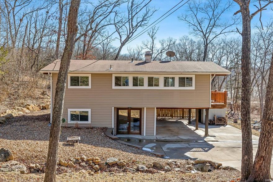 Now is your chance to live in walking distance to the beach at Lake Sherwood! Come live the LAKE LIFE - just in time for summer!  This 3 bedroom, 2 full bathroom raised ranch has covered parking, a flat driveway, shed to store your tools/toys, and a fenced in backyard. Windows and atrium doors line three walls in this open kitchen/dining/living room area, making you feel like you are living amongst the trees, and allowing a slight water view of the lake. Step out onto the wrap-around deck and relax as you have your morning coffee. On nice days, you can open the windows/doors and feel the breeze.  During colder days, you can use the stone wood-burning fireplace that also serves as the centerpiece of the open living area. Lots of major updates have been made to this home including: updated windows, HVAC, water heater, vinyl siding, soffit, fascia, water drainage systems. Lake Sherwood is a gated lake community with 6 lakes, motorized boating, UTV friendly, plus much more! Come see today!