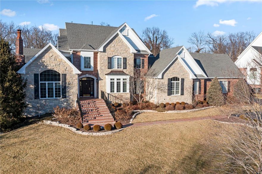Don’t miss this Johnson-built home on 1+ acres in the coveted Hunters Pond neighborhood/Ladue School District. Enter through large foyer with marble floors and grand curved staircase, looking into the gorgeous 2-story great room. Floor-to-ceiling windows provide ample natural light and beautiful views of PebbleTec pool and private yard. Find a paneled study with fireplace and vaulted ceilings off of the foyer. The elegant, eat-in kitchen with luxury stainless steel appliances, custom cabinets, and granite countertops that flows to vaulted hearth room with gas fireplace, built-in entertainment center, and doors opening to the pool and covered patio with gas fire pit. Built-in bar w/ wine cooler is located between the hearth and great room. Primary bedroom suite with updated bath, huge laundry room, full bath, 3 car garage completes the first floor. Upstairs, find 3 more updated bedroom suites. LL provides another bedroom and full bath, theater room, fitness room, and rec room with bar. Additional Rooms: Mud Room