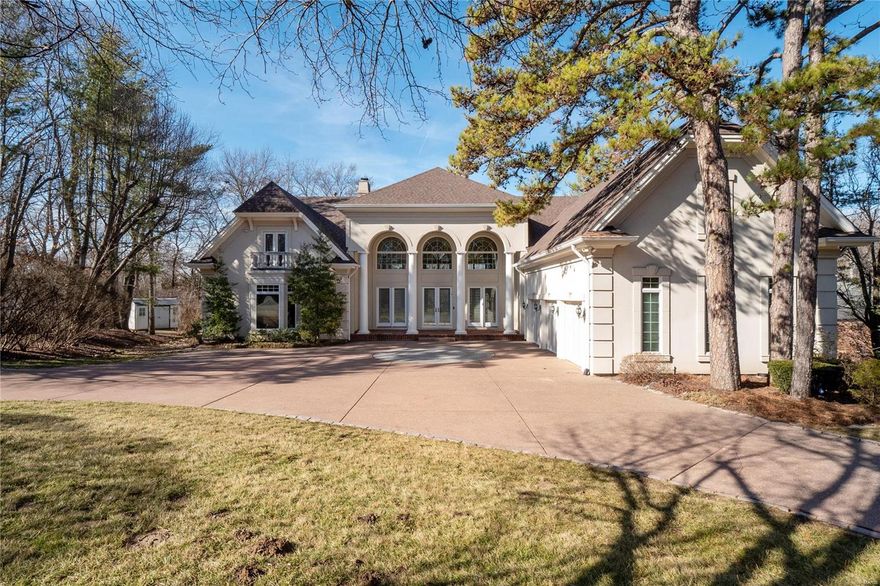 Improved Price! Spectacular home situated on a beautifully wooded lot. A 2-story Entry Hall with beautiful archways & palladian windows opens to the Living & Dining room with soaring ceiling, stunning mantel, built-in bookcases, French doors that open to the patio & pool creating a dramatic first impression. A well designed open floor plan with defined living spaces creates the perfect flow for those who love to entertain while still offering spaces that promote intimate gatherings. Private paneled Library/Office with built-in desk, main floor Bedroom suite, Sitting Room & spa-like bath with soaking tub, large walk-in closet, light and bright updated Kitchen boasts top-of-the line appliances, marble counters, custom cabinets, Breakfast Area with bay window & hearth room with fireplace all opening to pool and patio. The second floor Bedrooms have walk-in closets & private baths. Unique Lower Level Recreation Area with custom bar, Media Area, Game Area and full bath. A Must See