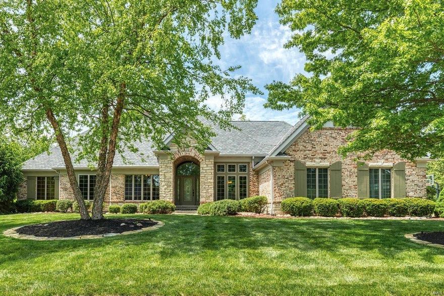 An impressive brick & stone elevation highlights the remarkable curb appeal of this spectacular Schaeffer-built ranch home. Open floor plan features 12’ ceilings, extensive millwork & handscraped hickory flooring. Impressive hardwood foyer leads to private study with built-in bookcase, formal dining room and stunning great room with box beam ceiling, brick fireplace & bank of windows. Designer kitchen with glazed cabinetry, granite countertops, premium appliances & butler’s pantry adjoins light-filled breakfast room with wide bay window. Spacious master bedroom suite with luxury bath with walk-in shower offers an appealing retreat. 2 Additional bedrooms & hall full bath complete the main floor living quarters. Lower Level includes recreation room with wet bar, office, workout room & full bath with sauna. Situated on parklike .74-acre grounds with outdoor living room, resort style pool with waterfall & patio with full-height fireplace plus 2-car garage & detached garage with bonus room.