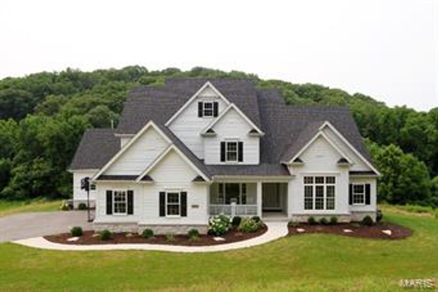 This stunning almost new 1.5 story is situated on a picturesque 3 acre lot. One of Micelli’s bests, this home combines a fantastic floor plan with exquisite finishes. Dark engineered wood floors flow through most of the mn level. The formal dining room has elegant millwork & a gorgeous chandelier. A private office is accessed thru French doors & has 12’ ceilings. The elegant great room has 11’ ceilings, a beautiful fireplace & a wall of windows. The designer kitchen features custom white mission style cabinets with glass front 2nd tier cabinets with many custom storage & built-in features. High end thermador appliances a farmhouse sink & quartz counters make this a dream kitchen. The lovely breakfast room & hearth room with beamed ceiling & built-ins open to a covered porch with a fireplace. The master retreat features a coffered ceiling & a fabulous bthrm. The upper level features 3 lrg bdrms, 2 full bths & a lrge bonus room. A walk-out lower level with deep pour is ready to finish.