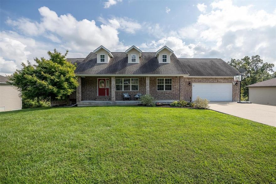 If you are needing room to grow, this gorgeous brick-front home has space for everyone! Featuring 5 bedrooms, plus bonus rooms, you'll find this home offers more than 3300 square feet of living space. Spacious living areas can be found upstairs and down, with additional rooms for all your activities, including the perfect home office, craft room, workshop area and even a storm shelter and extra storage space. This home was thoughtfully constructed with a divided floor plan for extra privacy to the master bedroom and classic details throughout such as vaulted and tray ceilings. For those who enjoy spending time outside, check out the brand new deck and the covered front porch, as well as the large 1/3 acre lot with plenty of room to play. In the colder months, curl up and crank on the gas fireplace, guaranteed to keep you nice and toasty. No need to worry about finding the perfect home, this one is turn-key, like new with a variety of recent updates and everything you could need.