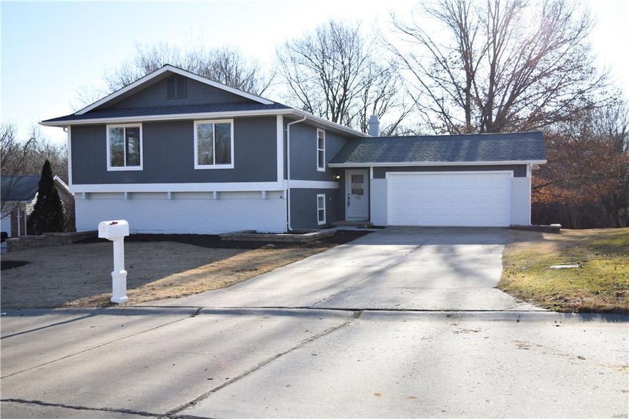 Beautifully renovated split foyer with new windows, roof, gutters, deck, flooring and more. You'll love the modern kitchen with sleek quartz countertops and waterfall island! Finished lower level with living room, optional fourth bedroom, and full bath. Lower level is a walkout that opens up to a big backyard which backs to woods and common ground. Come see us at the open house Sunday February 4th from 12pm-2pm.
