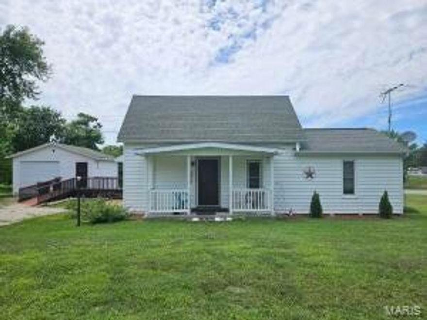 LOOK AT THIS ONE! Beautiful updated home with warm and inviting floor plan. Several updates include new wiring, breaker box, windows, and insulation and a Trane furnace The outside has a beautiful covered back deck for entertaining and family barbecues! There is a shop with concrete floors and electric, ready and waiting for craftsman or hobbies or for storage, there is also a basement in the shop for added storage or a safe room! The home has a country feel to it and the large yard and place for a garden gives you the feeling of the country life! The stores and Down Town Area are just a few blocks away! The town is a very nice mix of old and modern stores! So come check this home out, and start making memories!