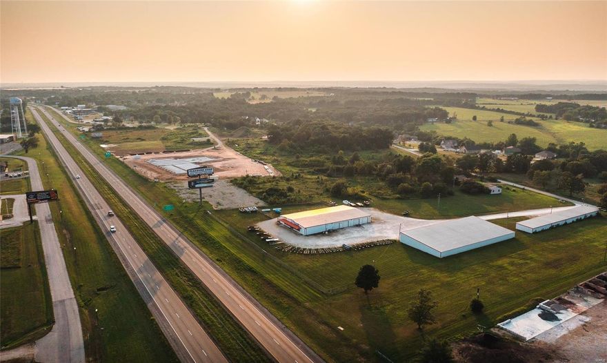 This outstanding 4.6-acre property boasts sought-after I-44 frontage, making it the perfect fit for your business. The main retail building includes a spacious showroom, three offices, a well-equipped kitchen, a conference area, and three restrooms (one with a shower). Additional features include ample storage space and a well-equipped shop with overhead doors. Inside the building, you'll find five propane furnaces with air conditioning for year-round comfort. It's well-lit and secured with a comprehensive security system. This property also includes an 80x160 storage facility with bays and overhead doors, comprising 16 individual storage units, providing both storage options and an additional income stream. After 45 years of service in Central Missouri, the owner is retiring, presenting a unique opportunity for you to establish your business in this prime I-44 location. Don't miss out on this chance to thrive in this bustling area! Location: High Traffic, Hwy/Interstate Frntg