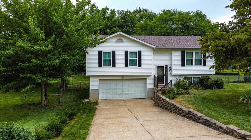 Welcome to your new home! 3 bedroom, 2 full bath home located inLake Saint Louis (Wentzville School District). This 1,060 sq ft split foyer home makes perfect use of space with an open concept feel. The main level, includes great room with vaulted ceiling into the dining room. Kitchen includes custom painted cabinets, backsplash & pantry. All 3 bedrooms on main level with new carpeting. Both updated full bathrooms (2020) located on main level. New windows 2021. New HVAC 2020. New Water Heater 2020. New laminate wood flooring throughout main level of home. Downstairs hosts oversized garage, laundry, and rec/ living space or even sleeping area. Access to deck located off the kitchen/ dining area. Large fenced backyard, perfect for entertaining. Off the dining area, you will find a deck that leads you to large fenced backyard perfect for entertaining. Minutes from both highways 70 & 40/61, tons of shopping, restaurants and stores nearby.