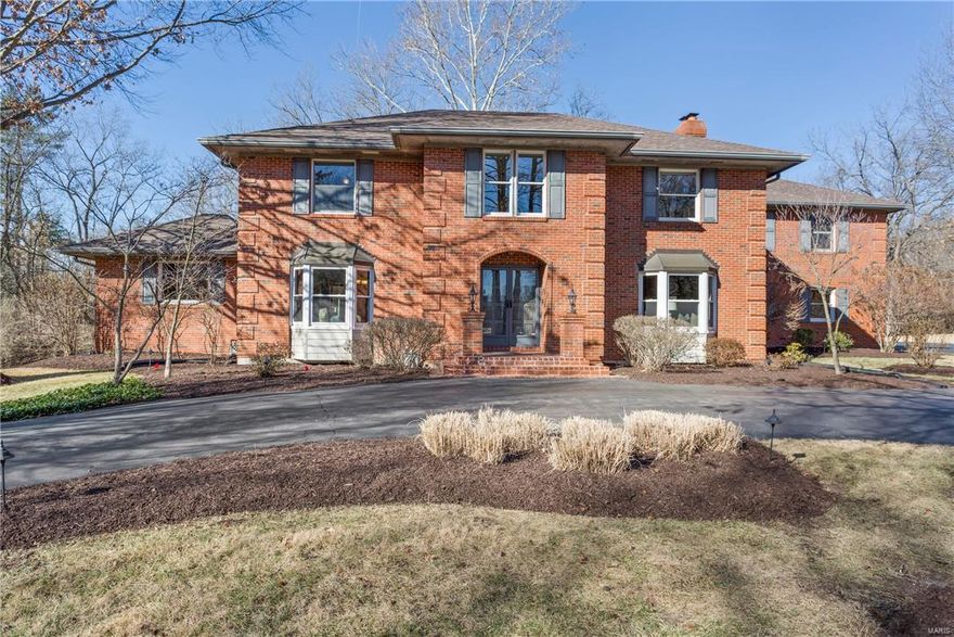 This stunning 2-story sits on a lovely 1.5 acres cul-de-sac lot at the end of a private Town and Country lane, custom built by these original owners. A classic brick facade gives way to an updated, sophisticated interior, smartly designed for multi-generational living. The main level features large rooms, an open floor plan and oak floors recently refinished in “Coffee Brown”. The kitchen showcases fresh subway tile backsplash and high-end appliances, along with loads of counter and cabinet space. This home offers TWO master suites, with one on both the main and upper levels. The lower level is absolutely incredible! A second full kitchen and completely renovated, making an entirely separate living quarters, which the total living area of the home to more than 7,000 square feet. Parking is a breeze with a side-entry 3-car garage and beautifully landscaped circle drive in the front. Freshly painted and ready for its next chapter, this is the by far the best value in T&C! Additional Rooms: Mud Room