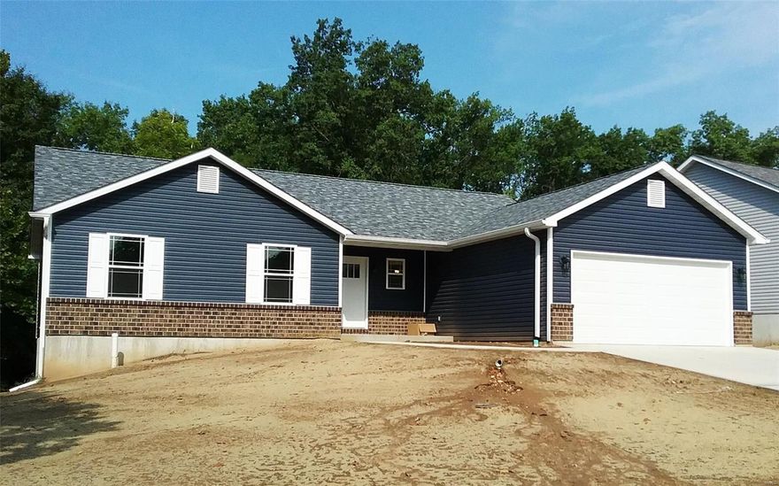 "TO BE BUILT" "BACKS TO WOODED COMMON GROUND" Ranch Home Offers 1370 Sq Ft Of Living Space* Interior Offers 3 Bedrooms & 2 Full Baths* Vaulted Ceilings* Ceiling Fans With Light Kits* Brush Nickel Lights & Door Hardware* Kitchen Offers Custom Cabinets, Stainless Steel Appliance's, Large Center Island With Brkfst Bar & Pantry* Master Suite With Two Closets & Double Sinks In Master Bathroom* Look-Out Lower Level With Rough-In Bath* Exterior Offers Architectural Shingles w/Ridge Vent* Vinyl Siding* 1/4 Brick* Enclosed Soffits & Fascia* Grids On Front Windows*Covered Front Porch* 2 Car Oversize Garage & Extended Driveway (Garage Width)* 1 Year Builders Warranty Plus A 2-10 Warranty* "BACKS TO WOODED COMMON GROUND"