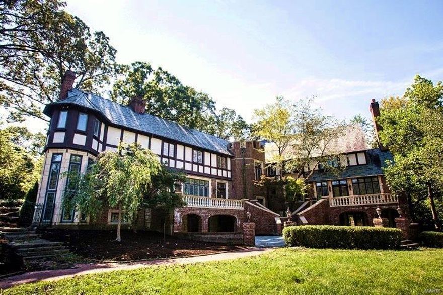 Spectacularly situated brick/stone Tudor mansion in one of the most prestigious neighborhoods in the region. Nearly 8,000 sf of luxuriously rehabbed and historically significant space. Extensive architecturally interesting features include terrazzo floors, marble and stone fireplaces, elegant staircases, updated lighting, hardwood floors, crown molding, several wet bars, wood trim, archways, wood beam ceilings, historical wood wainscotting, French doors, leaded glass windows, wrought iron handrails, built-in seating, garage to second floor elevator and lots of storage. The main home has 7 bedrooms, 8.5 baths and a beautifully finished basement that will be unsurpassed for entertaining. It houses a large bar, 2,000+ bottle, climate controlled wine storage, fireplace, sauna and cedar closet. Meticulously maintained English garden grounds with multiple patios, stone handrails, paved walkways and an amazing poolhouse with an in-ground pool. Not to be missed. Last sold for $4.6 million!! SpecialListingConditions: Foreclosure Additional Rooms: Sun Room
