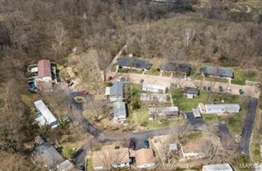 Fantastic Opportunity to own a Well Established Multi Use Property on 13+ acres in Fenton Missouri. Three Apartment Buildings offering a total of 24 units consisting of 20 - 1 bedroom units and 4 - 2 bedroom units are just the beginning of this amazing property. In addition to the Apartments the property offers 11 Mobile Home Pads with several mobile homes included in the rental portfolio. The property has great growth potential with acreage available for additional Apartment Buildings or additional Mobile Home Pads to add to your income potential. Onsite Laundry facility is available for tenants. The property is connected to public sewer and public water which makes this property even more appealing! The property has been well maintained by the original owners for 50 years. Now it's your turn!