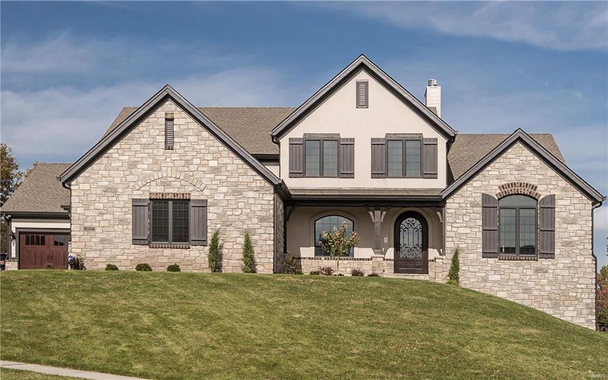 Elegant living at its finest,location,functionality & exquisite finishes throughout.This gorgeous 1.5 story Bellerive model features 5 bedrooms, 4.5 bath w/over 6,000 sq ft of living space & elevation unique to sought-after community at the Arbors.Expansive flagstone porches, brick & stone, extended driveways,OS garages,family foyer w/built-in nooks & bench & arched wrought iron 500# entry door just to start.7in white oak plank floors flow through to box beamed great room w/grand stone surround FP to hearth room w/stone FP overlook covered composite deck w/stone FP.Unreal kitchen w/full slab island,pellet ice maker,Wolf range,upgraded flush inset cabinets & much more.Spa-like master suite, dual raised vanities,custom closet w/natural light, sitting room, rain shower w/steamer, 9-body spray & speaker/light system. Wide spindled stairwell leads to loft w/wet bar,3 large bedrooms,jack-n-jill & full bathrooms.5th bed,THX theatre,rec & exercise room.W/O to patio w/stone fireplace & columns. COOL: 14 SEER+