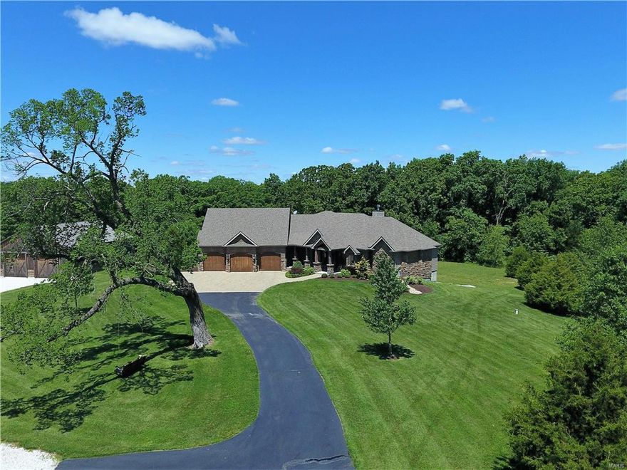 Old world charm and actual historic materials give this home the character and uniqueness that is hard to create and harder to find. The lush tranquil setting enhances the feeling that will overcome you the minute you approach the remote gated entrance and travel down the blacktop lane, past the stocked pond, toward the main residence and beautiful 52’ X 56’ barn/outbuilding. Inside and out, the attention to detail and high end quality and unique finishes are everywhere. Nothing is lacking, there is 
something special in every corner – just wait till you see it! And to top it off, even with heating the outbuilding, the average utilities are only $124/month due to the geo thermal and solar systems! It is truly a 17 acre oasis of your dreams; and you won’t even realize you are only minutes off Wentzville Parkway!There Additional Rooms: Mud Room