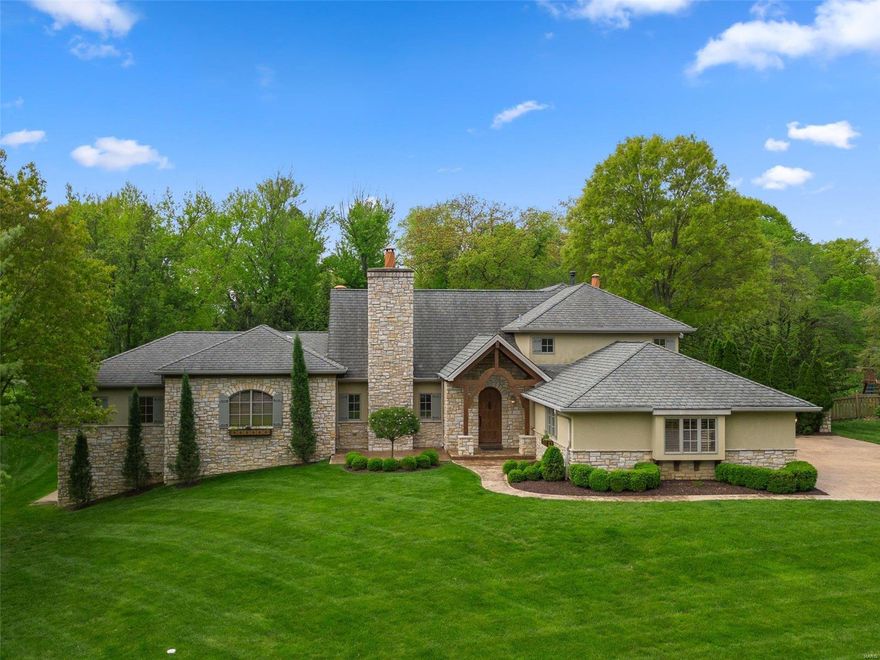 This home will impress the most selective buyer. Meticulous 1. 5 Story custom home with pool, hot tub & breathtaking outdoor living. The impressive features are too extensive to list but include: 
Gourmet kitchen with gas stove, waterfall granite countertop, custom cabinetry, walk in pantry & built in kitchenAid refrigerator.
Pool house with 2nd kitchen/bath/open window serving station -
Open floor plan with walls of windows throughout -
Master Bed w/ luxury bath -
Room sized walk-in closets -
3 fireplaces (living/hearth/outdoor) -
Library with custom millwork -
Fully finished walk-out LL with custom bar, rec room, family room, media room, office, gym, full bath with steam shower, wine cellar & plenty of storage -
Private yard - Backs to wooded lot -
3 car oversized garage w/cabinetry -
Oversized laundry/mud/craft room -
Quiet cul de sac location.
The interior features over 7000 beautifully finished sq. ft. Private home of custom home builder- no expense was spared. Additional Rooms: Mud Room, Wine Cellar