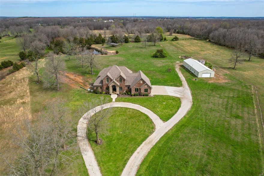 THIS IS A ONCE IN A LIFETIME OPPORTUNITY TO OWN A CUSTOM BUILT HOME W/40 ACRES CLOSE TO I44 ACCESS. ALL BRICK/ROCK WALK-OUT BASEMENT HOME W/OVER 5100 SQ FT. HUGE KITCHEN TO ENTERTAIN. GRANITE COUNTERTOPS, TONS OF SOFT CLOSE MAPLE CUSTOM CABINETS, SPACIOUS CENTER ISLAND, & STAINLESS APPLIANCES. FORMAL DINING ROOM, LIVING ROOM W/UNIQUE ROCK FIREPLACE. MASTER SUITE IS A GREAT SIZE, MASTER BATH HAS A WALK-IN SHOWER W/DOUBLE SHOWER HEADS & BODY SPRAYS. HEATED TOWEL RACKS & WALK-IN MASTER CLOSET WITH AMAZING NATURAL LIGHT. ON THE UPPER LEVEL THERE ARE TWO MORE MASTER SUITES WITH THEIR OWN BATHS AND WALK-IN CLOSETS. NOW, TO THE BASEMENT WHERE ALL THE FUN BEGINS! THE COZY CUSTOM BAR AREA TO HAVE A DRINK W/FRIENDS & FAMILY.  HUGE FAMILY ROOM WITH GAME AREA & PELLET STOVE. 4TH BEDRM AND FULL BATH, A POSSIBLE 5TH BEDRM THAT YOU COULD SLEEP IN FOR DAYS SINCE NO WINDOWS. GUN/HOBBY ROOM, OFFICE, STORM SHELTER ROOM & STORAGE SPACE. 30X60 SHOP W/LIVING QUARTERS & WORKSHOP. 3 PONDS & PERIMETER FENCED.