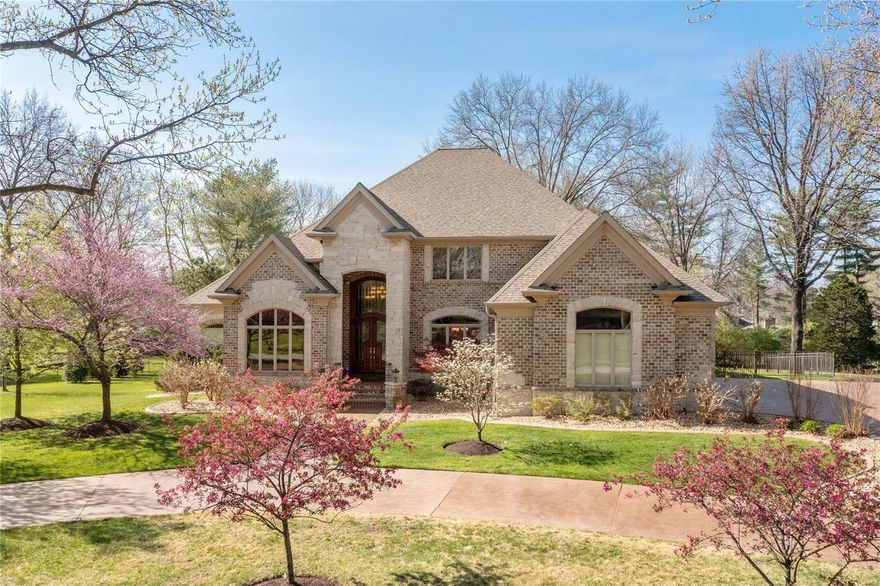 22 North Walling Drive is a gorgeous 16-year-old home, designed for entertaining on a grand scale or living simply every day. This fabulous brick and stone facade incorporates a traditional French Colonial roofline and charming gables while its spacious 4,800+ sq. ft. interior feels warm and welcoming right from the start. A dramatic two-story great room anchors the main level, flanked by a private master suite and kitchen with hearth room.  Enjoy gorgeous views of the property’s green space from every room with windows across the back of the house. The second floor includes 3 additional bedrooms, one with its own private bathroom, and two others sharing a Jack-and Jill. The lower-level was finished with the same high-quality touches as the main living spaces and features a large rec room, easy back yard access, and fabulous bar and home theater room, plus a 5th bedroom and full bathroom. This is a truly exceptional property in a wonderful Creve Coeur location close to everything! Additional Rooms: Mud Room, Wine Cellar