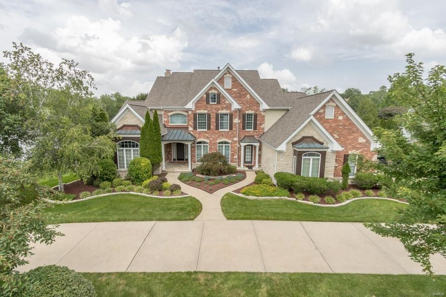 Drive up to the circle drive to this brick and stone home w/elegant French country appeal on premium lot in sought after Greystone, Walk-in to wood floors and soaring 20 foot ceiling, natural light pours into the great room thru the wall of windows - outside find one of the best yards w/heated pool and lush landscaping, all backs a beautiful stretch of common ground. Back inside find more than 6500 square feet of living space w/5 bedrooms + and 4 full baths + 2 half baths. Work from home? You will love the main floor office w/french doors for privacy, transom window and 11 ft. ceilings. Main floor master w/updated bath. The large kitchen/hearth room is the ideal setting for gatherings w/granite breakfast bar island and white cabinets. Just outside find a sunroom porch to take in the private yard. Downstairs a large finished basement w/gas fireplace, and pool bath w/changing room. All new carpet, plus newer roof. Rockwood Schools! Now at 185.00 a sqft an amazing value in Greystone. Some Accessible Features Additional Rooms: Mud Room, Sun Room