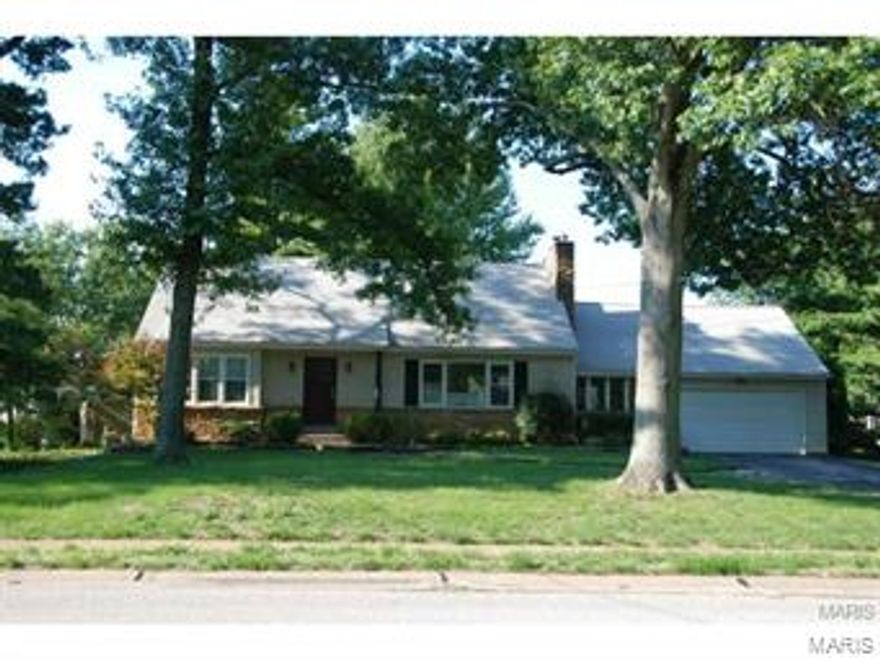 Charm.Updates.Warmth...and a closet to die for! That's what you'll find in this well-priced Olivette home. The stone-and-vinyl exterior and good-looking front door invite you to sit and stay a while. LR is graced with wood burning fpl, built-in shelves, and picture window. Separate dining room looks out over the perfectly groomed yard, & connects to an enclosed breezeway which would be a great office, playroom or family room. Kitchen: granite counters, 2 sinks, pantry, stainless appliances, tile backsplash, & gas stove will delight! 2 bedrooms on this floor have space-saving built-ins and share a bath. 2nd floor master has ensuite bath, built-in desk and bookshelves, romantic sloping ceilngs...and an 20' X 12' CLOSET! It has drawers, hanging space, shoe shelves, & space in the center for a chaise lounge. Partly fin LL; deck and beautiful gardens out back. Newer windows and lighting; most rooms recently painted;roof 6 yrs; new HVAC 2013. Walk to Old Bonhomme and Stacy Park. Terrific!
