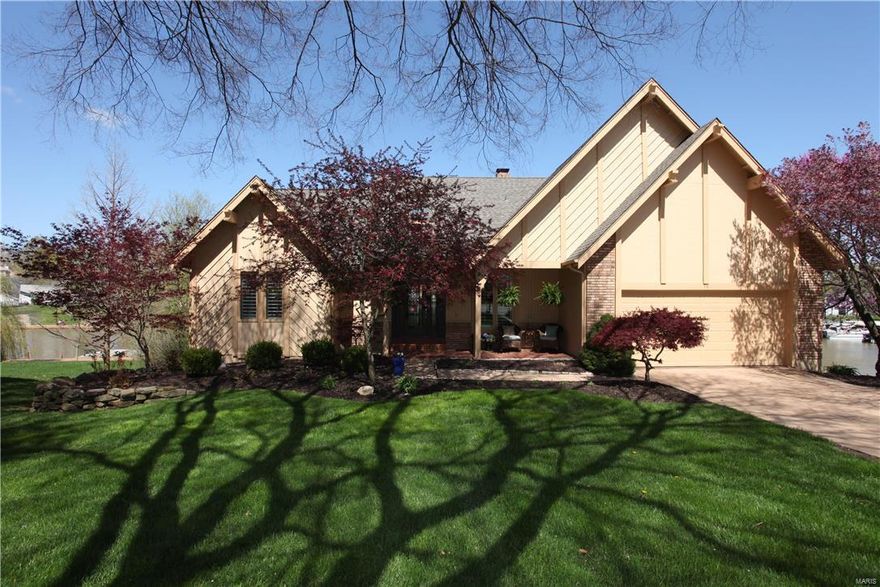 A fabulous waterfront where you can live life to the fullest! This completely updated home will leave you with nothing to do except lounge by the heated pool or take a cruise in your boat! Solid surface flooring adorn every inch of the home; from Teak hardwood, slate and ceramic tile! The kitchen has a see thru gas fireplace to the great rm, wall to wall granite, a butler pantry, tri-level center isle with a breakfast bar and a corner sink looking out over the lake! The mstr bdrm suite has a large bay window, twin closets complete with organizers and a luxury bath. The LL offers a large family room w/wet bar, fireplace, 2 bedrooms, den and full bath. The outdoor life is what you will love; big water views but located on a no wake cove. No sea wall to care for as there is a boardwalk, private boat dock and lift. Full Paverstone patio, pool decking and steps leading to the dock. Lushly landscaped with a waterfall, Koi pond and full irrigation from the lake to complete this outdoor oasis.