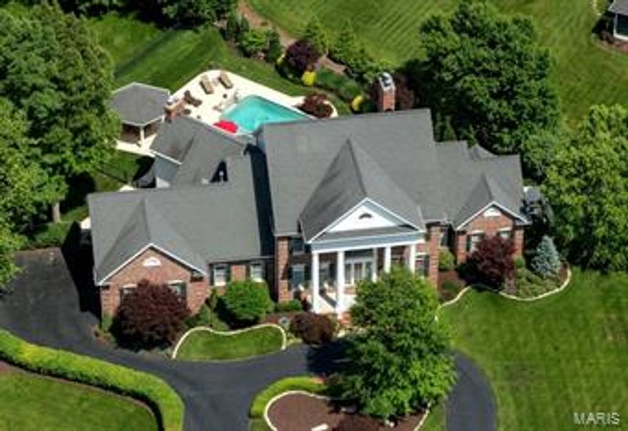 SELLER IS READY TO MOVE ON, WILL CONSIDER ALL REASONABLE OFFERS! 1.5 story. 5 Bedrooms; 8 Baths. Quality finishes, throughout. Master Wing enjoys fireplace, organized closets, steam shower & jet tub. Open and expansive main level. Great Room overlooks decks, salt water pool & fountains. 3000 SF finished, walkout Lower Level incorporates every functional and recreational need; Billiard Room, Wine Cellar, 2 full baths, Home Theater, Executive Office w/Potential 6th Bedroom. Extravagant detailing in millwork, plantation shutters and surround sound. The gourmet kitchen offers heated floors, Viking & SubZero, butlers pantry, wine chiller & pantry. Hearth room w/stone work FP. 4 Master-sized BRs w/ 3 full baths are found on the second level. Generous allowance to buyers to change all carpeted areas to new hardwood floors.