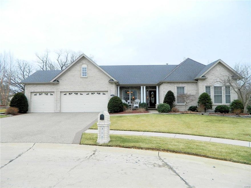 Executive Atrium Ranch With Brick Front On Wooded Walkout Lot Backing To Common Ground! This TR Hughes Oakbrook model home w/ over 3400 sqft of luxury living has pebble stone epoxy driveway, walkway & porch & 3 car garage! Leaded glass front door leads to entry w/ wood flooring, archway to formal dining room which opens to vaulted great room & atrium! The kitchen is a chefs delight w/ granite counters, Jenn-Air gas cooktop, built in oven, custom cabinets & wood flooring which extends to breakfast rm w/bay window & flows to Hearth room w/gas fireplace & bay window. Glass French doors lead to den on main level! Huge master bedroom has bay window, 2 walk in closets & luxury bath w/ soaking tub! Two other nice size bedrooms & full bath! Walkout LL is finished w/ family room w/ wet bar, 4 th bedroom, full bath, media/rec room & lots of storage!! Other features include, 2 patios, deck, irrigation system & security system! Private lot backing to woods.  Great location!