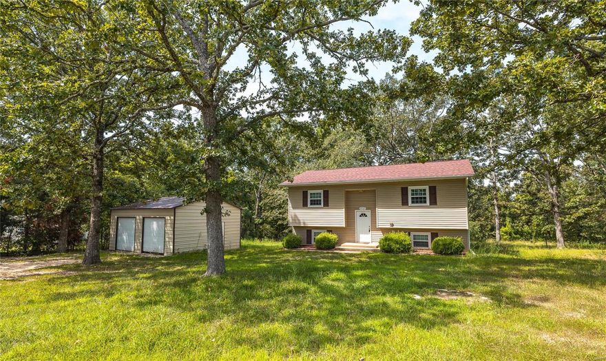 Tucked away on nearly an acre, this charming split-level home offers the perfect setting for a relaxed Waynesville living! Picture your mornings on your soon-to-be-installed brand-new deck, tackling projects in the detached 2-car garage, and winding down in a home that’s both roomy and inviting. With a new septic system also on the way, the groundwork is set—now all it needs is your unique touch. Ready to turn this house into your home? Schedule your tour today and start your next chapter!