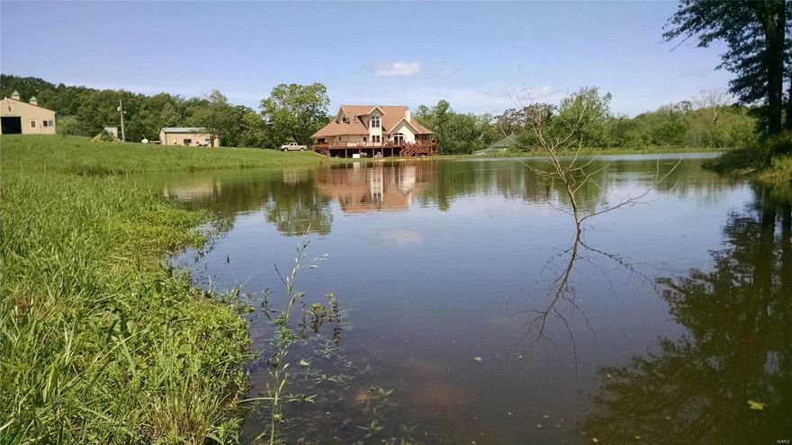 Horse property, 120 acres, pasture, woods. Spring fed stream, wildlife. Custom built, high-end 5400 sq. ft. m/l, great room w/17 ft. ceilings, wood burning stove, Kitchen custom maple cabinetry w/granite, island, pantry twin dual fuel Jenn-air range, formal dining, Canadian maple floors through-out home, master suite main level w/lg en-suite bath, walk-in shower, two walk-in closets, doors to deck, first floor laundry, screened porch, 1800 sq. ft. deck that overlooks 3/4 acres m/l pond. media room w/surround sound,  office suite that could be divided. Full basement, library, 2nd master suite, master bath, work-shop, kitchen, storage room, craft room, safe room for storms or your wine, geothermal, central vacuum, whole house intercom, fenced 6000 sq ft garden, orchard, roof in 2017. 40x50 workshop w/heat, air,  offices, warehouse space, 2 overhead doors, 1/2 bath. Six stall horse stable heated tack room, w/1/2 ba, stalls custom welded steel doors, poultry house. Whole house generator.