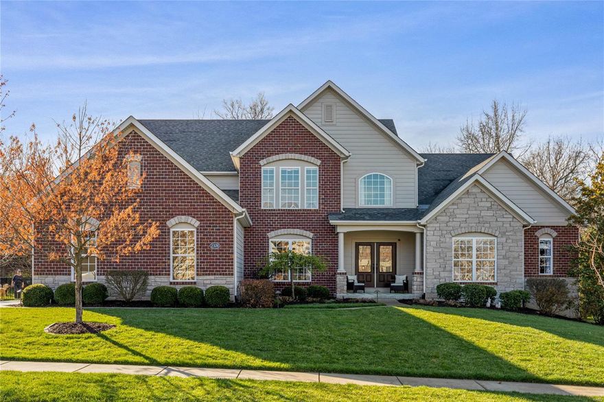 An impressive brick & stone elevation highlights the remarkable curb appeal of this spectacular Fischer & Frichtel-built 1.5 Sty. Hardwood entry foyer highlighted by flared staircase leads to private study with French doors, formal dining room & stunning great room with dramatic bank of windows. Designer kitchen featuring 42” cherry Shaker cabinetry, granite countertops, premium appliances, 7’ center island & butler’s pantry adjoins light-filled breakfast room with wide bay window & sliding glass to deck & hearth room with marble fireplace. Coffered primary bedroom suite radiates warmth with a direct vent fireplace, luxury bath & atrium door that opens to screened porch. The 2nd floor extends the living quarters with 3 additional bedrooms, 2 with Jack n’ Jill bath, bonus room, game room & hall full bath. Lower Level entertainment space includes recreation room with wet bar plus 5th bedroom & full bath. Situated on a .5-acre lot with composite deck, patio & screened porch with hot tub.