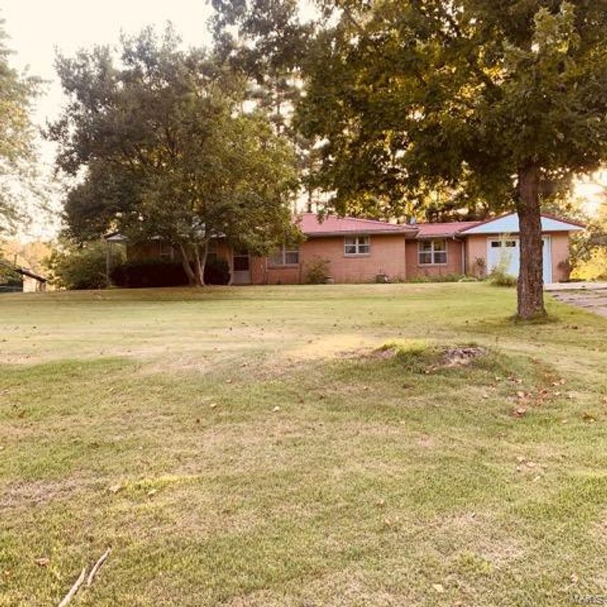 Possibilities galore on a nice piece of the country. This home offers two bedrooms, one bath, formal dining room, main level laundry, beautiful birch cabinets in the kitchen and a sunroom/breezeway. Original wood floors and a metal roof. One car attached garage, approximate 20 x 30 shop with a concrete floor and large wood burning stove; garden shed, chicken coop and a pond on 5.38 acres. Walkout unfinished full basement. Quiet, relaxing and perfect spot for some garden therapy. Priced to Sell!! Additional Rooms: Sun Room