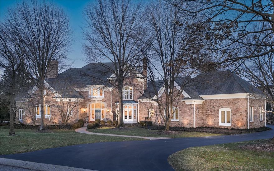 Refined, classic home in an exclusive private setting on a gated Frontenac lane. Custom built by Johnson Homes, the property features keynotes of a 3-level floating staircase, unique architectural details, marble and job finished wood floors, a 3-level elevator, newer roof, garage doors & openers, and a finished lower level. An expansive Higginbotham addition is an all-inclusive apartment above the 4-car garage, elevator ready, with separate entrance and security system. A Main level primary suite features see-thru fireplace, private sunroom, and deck access. The luxe bath has jet tub, walk-in shower, vault ceilings, double vanity, and room-size organized closet. Kitchen outfitted in 2 islands, breakfast room and  hearth room detailed with a star in inlaid flooring. 3 suites on level 2, one of which can be another primary suite. Oversize lower level with full kitchen, bar, exercise/party room, media & billiard rooms, and sleeping area w/full bath. New price is below current appraisal.